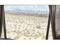 Desert landscape view from a window with sheer curtains at 2016 Mesquite Ln # 302, Laughlin, NV 89029