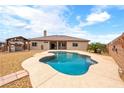 Backyard with a private pool, desert landscaping, a covered pergola, and a fully fenced yard at 2020 S Omaha Ave, Pahrump, NV 89048