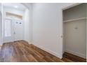 Bright foyer with wood floors, white walls, and closet space with easy access to the front door at 203 Sea Rim Ave, Las Vegas, NV 89148