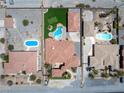 An aerial view shows the layout of the property, including a pool, putting green, and surrounding neighborhood at 2181 E Winery Rd, Pahrump, NV 89048