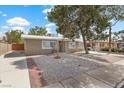 View of front exterior features desert landscaping, and a paved driveway at 2408 Berkley Ave, Las Vegas, NV 89101