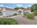 Inviting single-story home with desert landscaping and a covered front entry at 3201 Beacon Shores Cir, Las Vegas, NV 89117