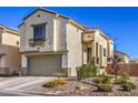 Attractive home with desert landscaping, a two-car garage, and a covered front entrance at 3592 Gloucester Gate St, Las Vegas, NV 89122
