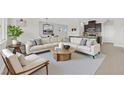 Bright, modern living room featuring a comfortable sectional sofa, stylish decor, and an open-concept design at 367 Wilford Springs St, Henderson, NV 89014