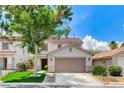 Charming two-story home with a well-manicured lawn, mature tree, and a two-car garage at 3717 Shanagolden St, Las Vegas, NV 89129