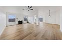 Open-concept living space with lots of natural light, fireplace, and wood flooring at 383 Virginia Lake Ave, Henderson, NV 89015