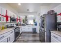 Bright kitchen featuring stainless steel appliances, white cabinets with modern hardware at 4429 E Azure Ave, Las Vegas, NV 89115