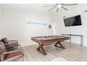 Spacious game room with a pool table, modern décor, and plenty of natural light at 4471 Wisconsin Ave, Las Vegas, NV 89104