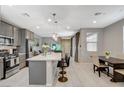 Bright kitchen with a large island, stainless appliances, and an open floor plan at 4537 Cloudrest Peak St, North Las Vegas, NV 89031