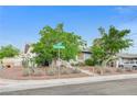 A single-story house with desert landscaping and a chain-link fence along the front yard at 601 Huntington St, Las Vegas, NV 89107