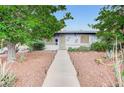 Charming single-story home with desert landscaping, a walkway, and a well-maintained front yard at 601 Huntington St, Las Vegas, NV 89107