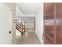Open concept foyer with staircase and view to the living room at 6901 Whisper Canyon Pl, North Las Vegas, NV 89084