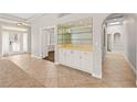 Inviting entryway with a built-in bar, tiled floors, and an open layout at 7920 Aspect Way, Las Vegas, NV 89149