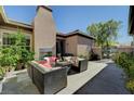 Outdoor patio area with fireplace and comfortable seating, perfect for relaxing and entertaining at 8564 Mayport Dr, Las Vegas, NV 89131