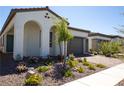 Beautiful single-story home featuring an arched porch entry, neutral paint, tidy landscaping, and brick driveway at 862 Silverton Springs St, Henderson, NV 89011