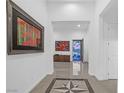 Bright foyer boasts elegant tile flooring and views to a front yard, enhancing the home's welcoming ambiance at 9 Porto Malaga St, Henderson, NV 89011
