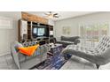 Cozy living room featuring modern decor, plush seating, and plenty of natural light at 9161 Rolling Sky Dr, Las Vegas, NV 89178