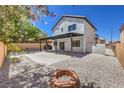 Large backyard has patio, pergola, and stone landscaping at 9321 Dancing Daffodil Ave, Las Vegas, NV 89129