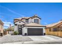 Two story home featuring a tile roof, dark trim, and desert landscaping at 9321 Dancing Daffodil Ave, Las Vegas, NV 89129