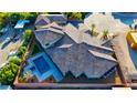 Aerial view of the sprawling property highlighting the tile roof, pool, spa, and lush landscaping at 9865 Bright Angel Way, Las Vegas, NV 89149