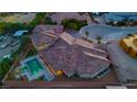 An aerial view of a private home with an inviting pool and lush landscaping at 9865 Bright Angel Way, Las Vegas, NV 89149