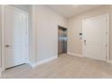 Hallway featuring an elevator, and two doors on opposite sides of each other at 128 Los Cabos Dr # 301, Las Vegas, NV 89144