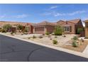 Charming home featuring a well-maintained yard with desert landscaping at 1407 Wheelwright Ct, Mesquite, NV 89034