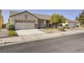 Lovely single-story home with a two-car garage and low maintenance landscaping at 1408 Reebok Ter, Henderson, NV 89014