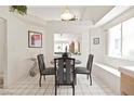 Cozy dining area with stylish chairs, decorative wall art, and ample natural light at 1728 Crystal Chimes Dr, Las Vegas, NV 89106