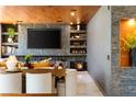 Modern living room featuring a fireplace, dark marble accents, and built-in shelves at 298 Grant Ridge Dr, Henderson, NV 89012