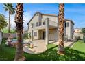 Home featuring an inviting backyard oasis with a pool, mature trees, and second story patio at 313 Vista Glen St, Las Vegas, NV 89145