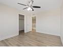 Bright bedroom features contemporary floors, a ceiling fan, a closet, and a neutral color palette at 340 Autumn Palace Ct, Las Vegas, NV 89144