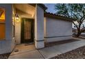 Inviting front entrance with security door, decorative brick pathway, and textured stucco wall at 3426 Side Saddle Ct, North Las Vegas, NV 89032