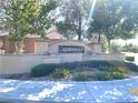 Attractive community entrance sign with beautiful landscaping and inviting street view at 3809 Van Ness Ave, North Las Vegas, NV 89081