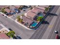 Aerial view of a lovely home featuring a private pool and an inviting backyard oasis at 3913 Lilac Haze St, Las Vegas, NV 89147