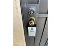 A close up of a front door with a lockbox attached at 4151 Sanderling Cir # 351, Las Vegas, NV 89103