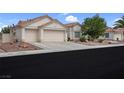 Charming single-story home featuring a two-car garage, desert landscaping, and a classic Southwestern style at 4628 Standing Bluff Way, Las Vegas, NV 89130