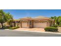 Attractive home featuring a well-maintained exterior, a gated entry, and a two-car garage at 4719 Riva De Romanza St, Las Vegas, NV 89135