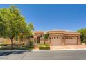 Charming home featuring a well-maintained exterior, a gated entry, and a two-car garage at 4719 Riva De Romanza St, Las Vegas, NV 89135