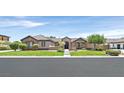 Charming single-story home with well-manicured front lawn and desert landscaping at 7408 Via Fiorentino St, Las Vegas, NV 89131