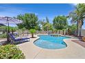 Backyard with a beautiful in-ground pool, spa, and lush landscaping at 7408 Via Fiorentino St, Las Vegas, NV 89131