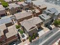 Aerial view of homes with well-maintained yards and a car parked in the driveway at 9053 Boston Springs Ave, Las Vegas, NV 89149