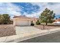 Charming one-story home with a two-car garage, tile roof, and easy to maintain desert landscaping at 9105 Marble Dr, Las Vegas, NV 89134