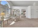 Bright dining room boasting high ceilings, a large window, and neutral carpeting at 9205 Desert Village Ave, Las Vegas, NV 89147