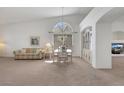 Bright, spacious dining area featuring carpet flooring, and natural lighting at 9205 Desert Village Ave, Las Vegas, NV 89147