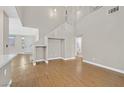 Bright living room with hardwood floors, high ceilings, and a view of the entry at 927 Clear Diamond Ave, Las Vegas, NV 89123