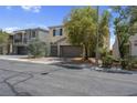 Charming two-story home featuring a well-maintained front yard, dual-car garage and cozy curb appeal at 9840 Chief Sky St, Las Vegas, NV 89178