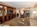 Comfortable living room with a TV, dining table, and a view to the kitchen at 145 E Harmon Ave # 1120, Las Vegas, NV 89109