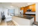 Modern kitchen with stainless steel appliances, granite countertops, and a breakfast bar in a bright and airy space at 200 W Sahara Ave # 910, Las Vegas, NV 89102