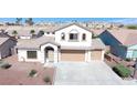 Inviting two-story home with a two-car garage, low maintenance rock landscaping, and desert surroundings at 2905 Shimmering Bay St, Laughlin, NV 89029